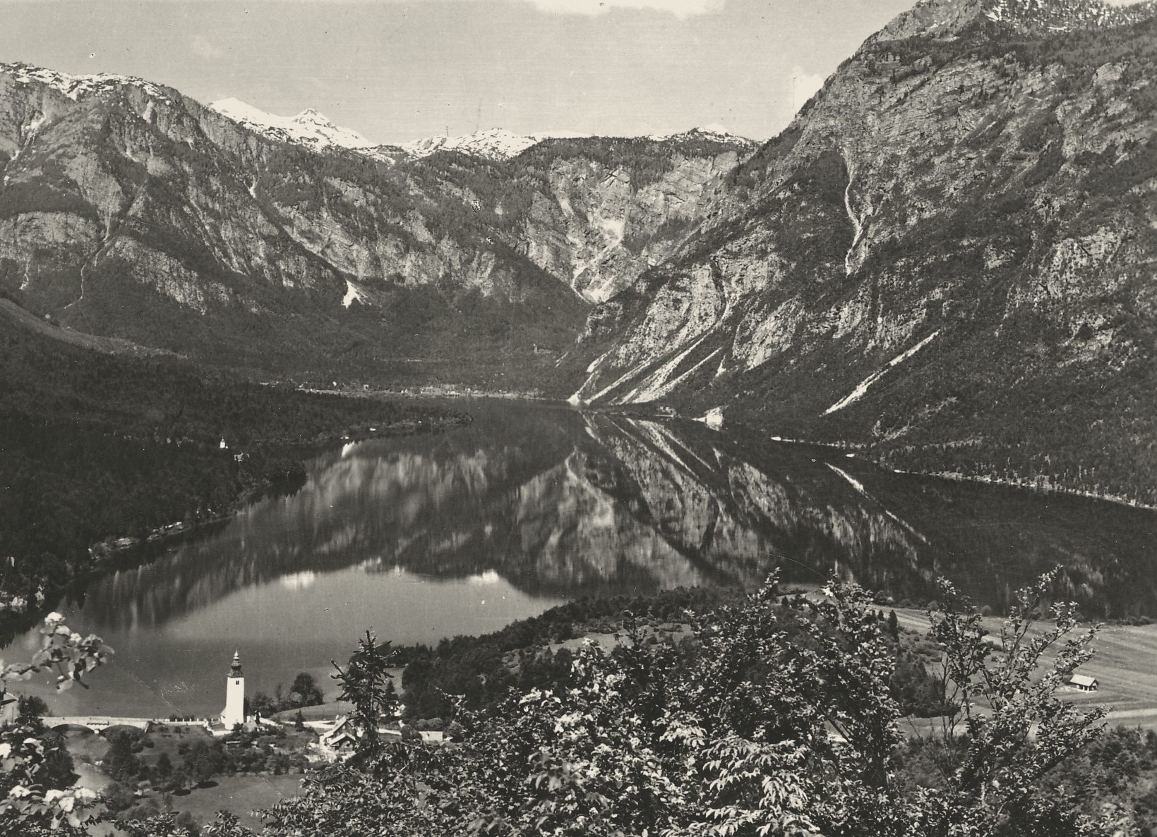 Lake Bohinj from above with the mountains behind, mid-century postcard