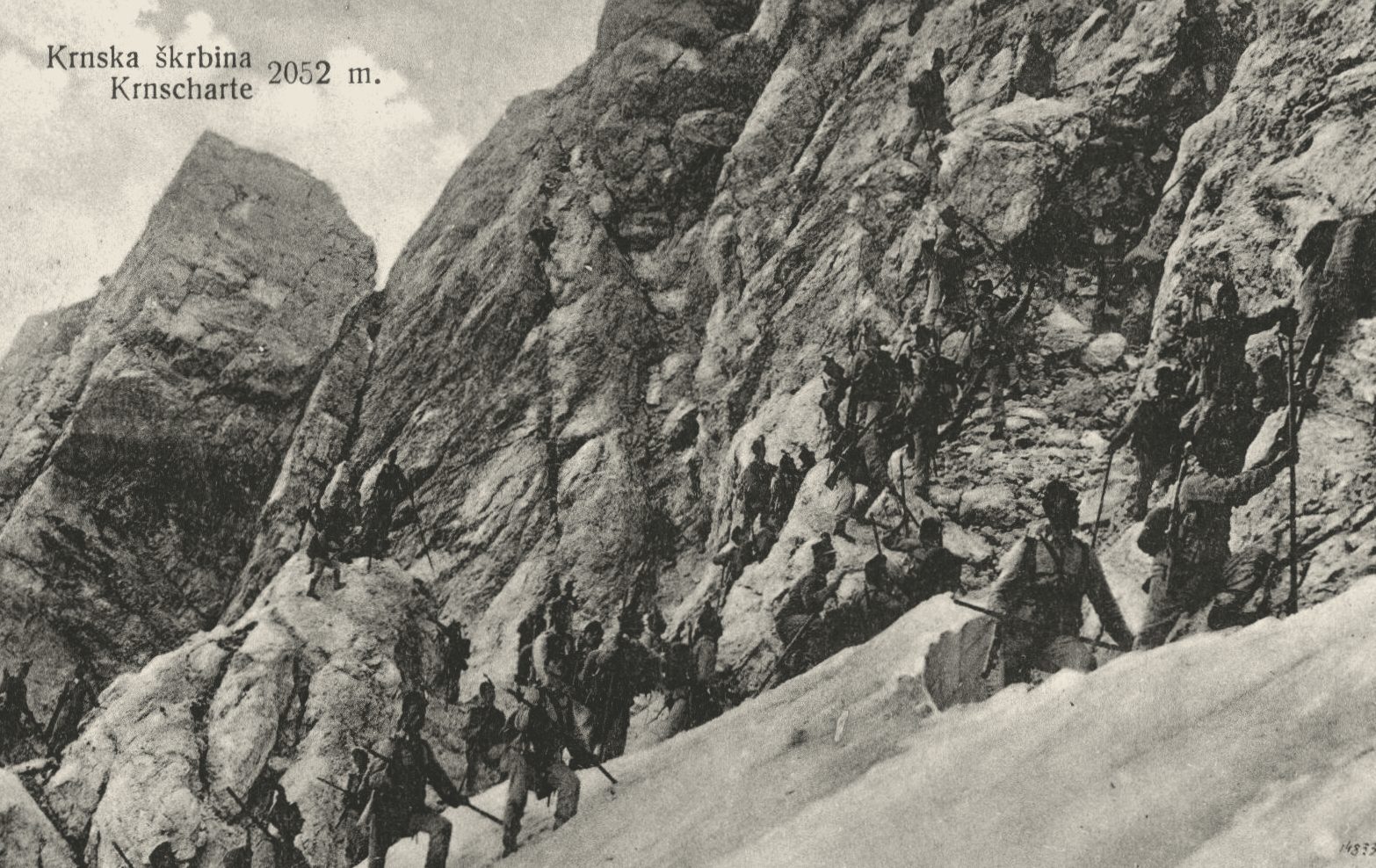 Walkers roped together on a rocky ridge in the Julian Alps, early twentieth-century postcard